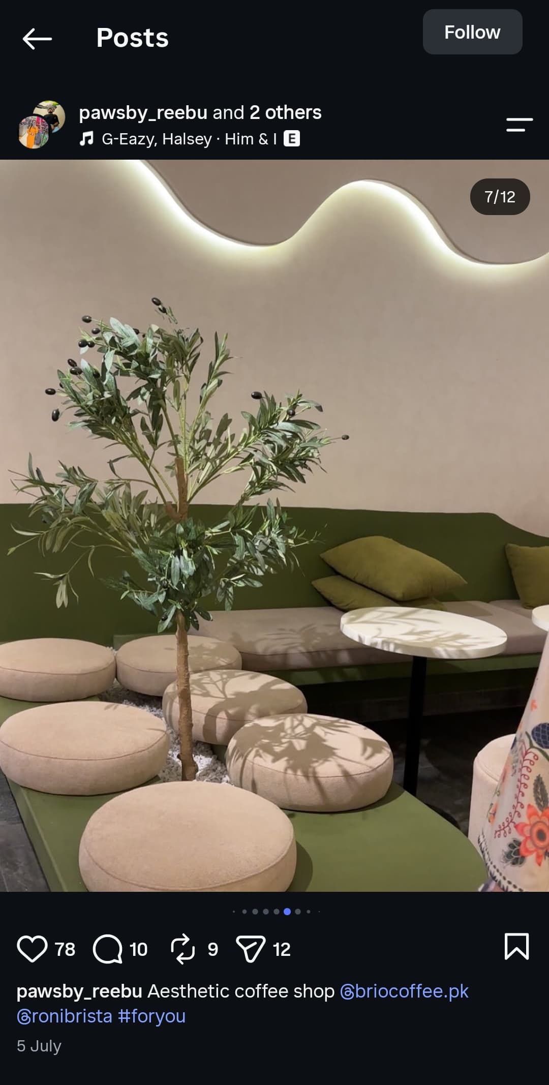 Olive tree lounge corner with cream poufs